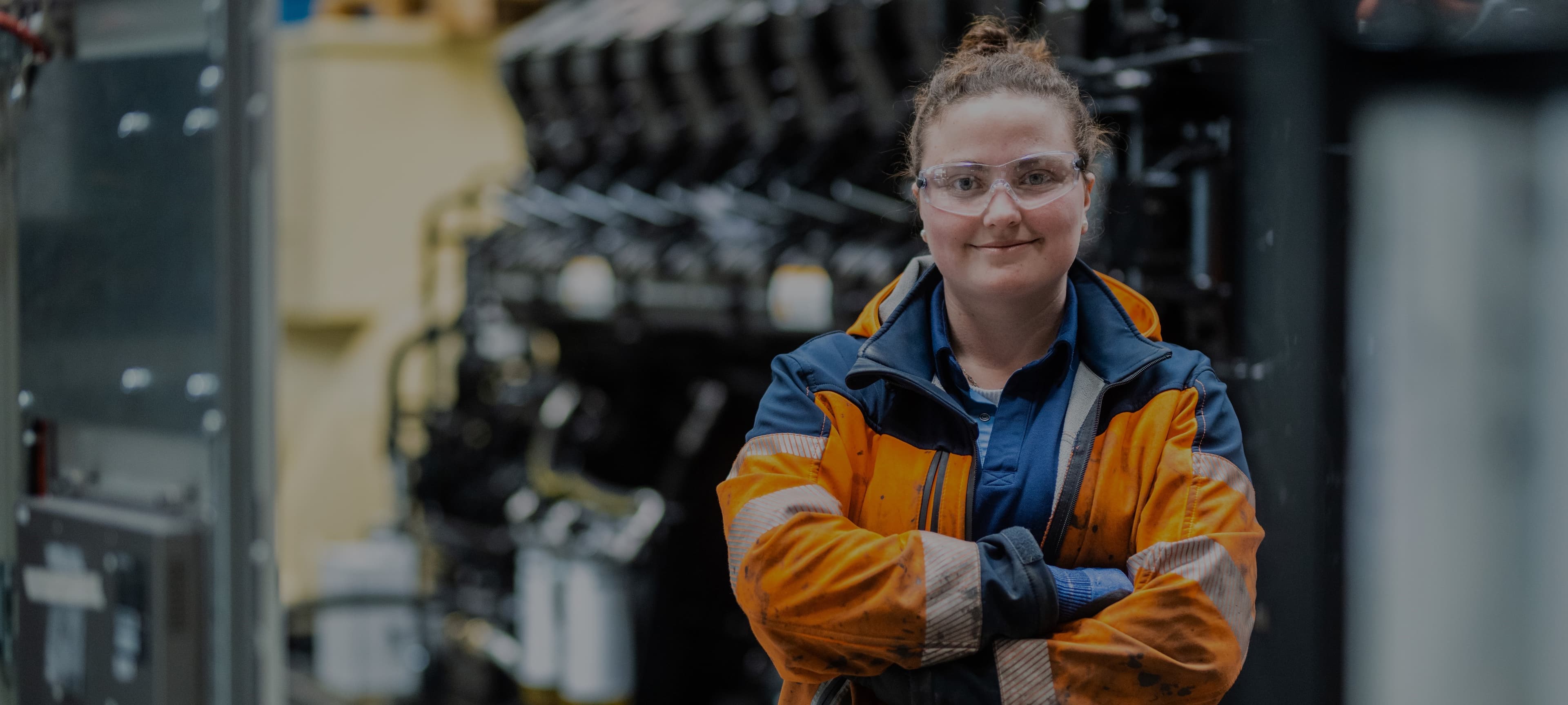 Production operator behind a KOHLER generator sets